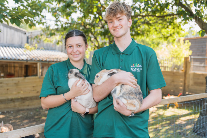 Staff holding rabbits