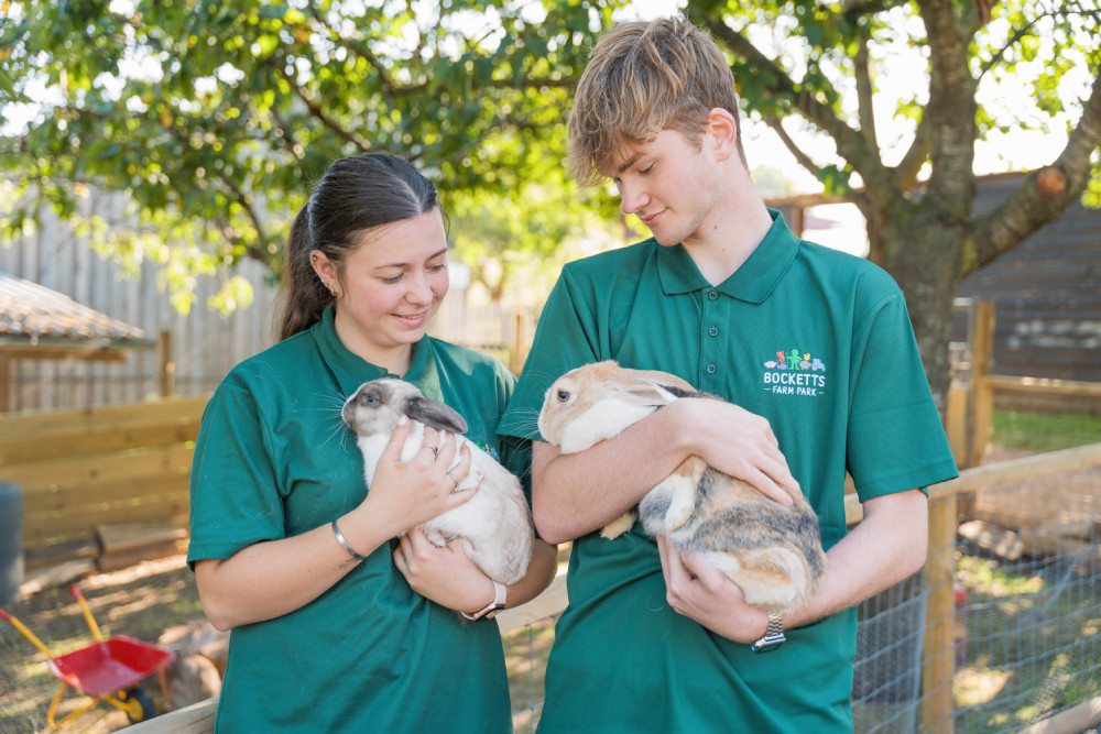 Staff holding rabbits