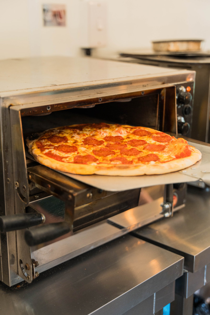 Staff making pizzas