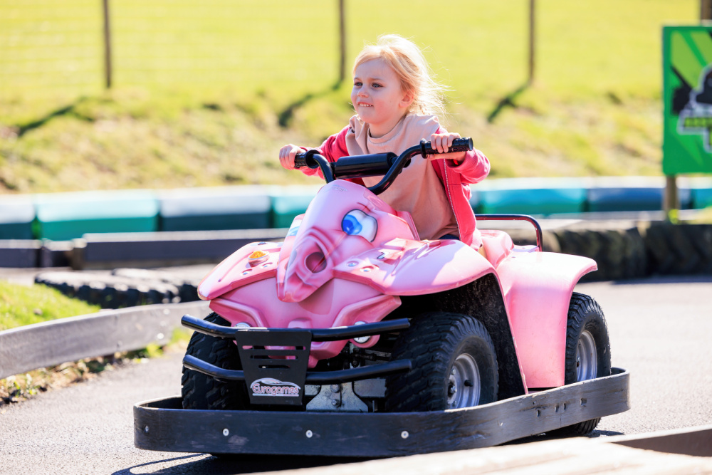Kid riding on a childs quad