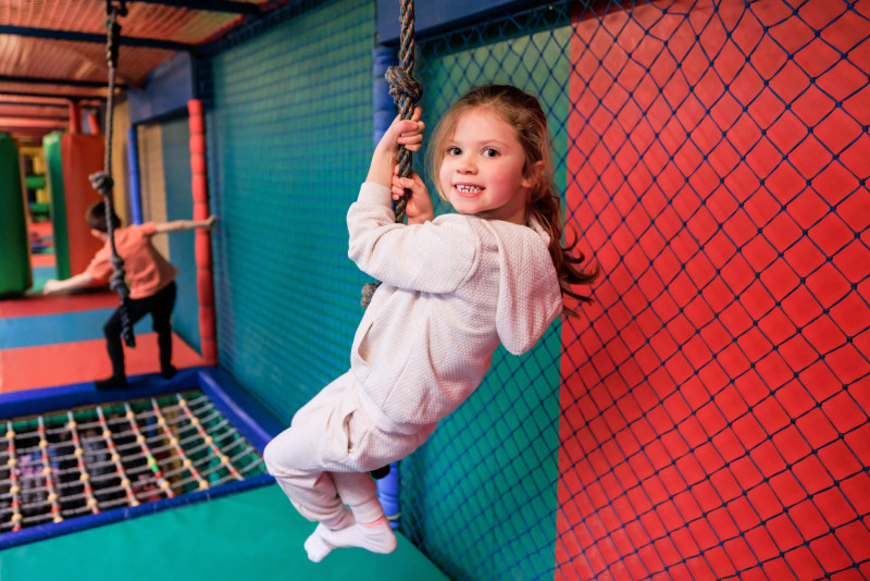 Kid playing in the indoor play area